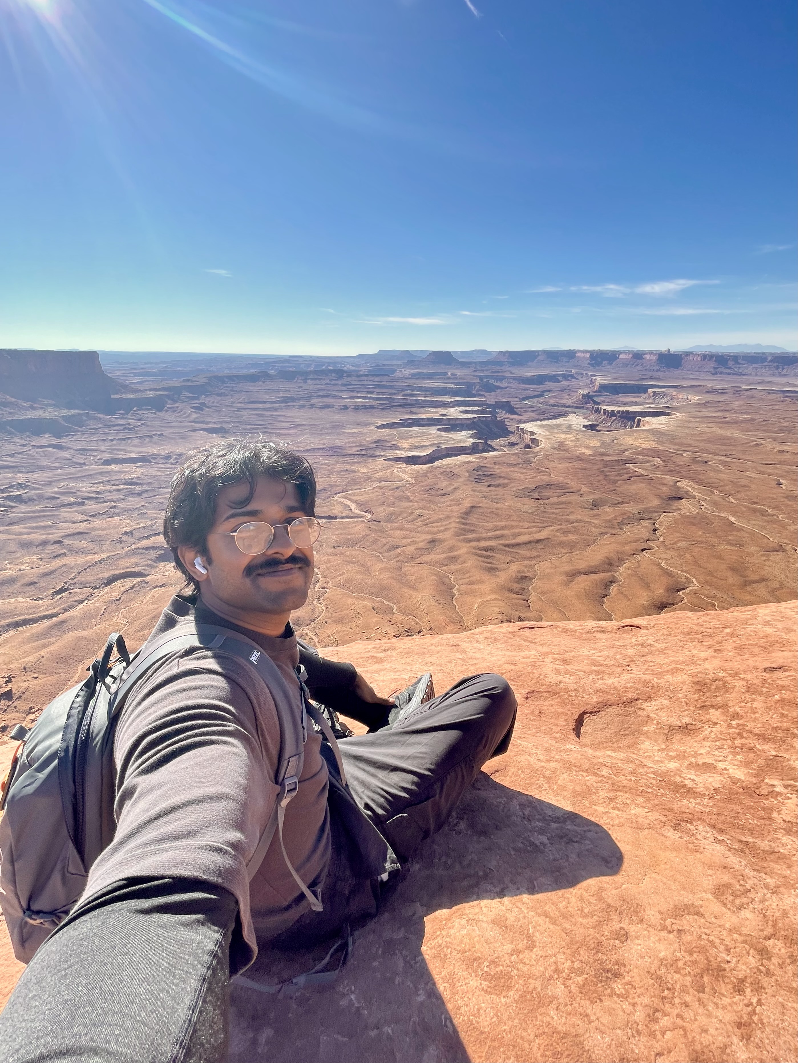Nickolaj Ajay Atchuthan overlooking the sandstone landscape in Canyonlands National Park